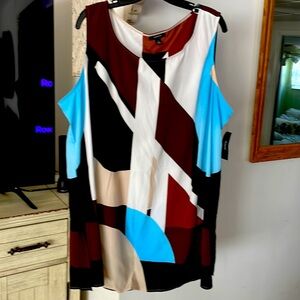 NWT Long sleeveless flowy top. Covers what you want to cover with style.